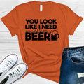 You Look Like I Need Another Beer Graphic Tee