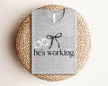 He's Working Corrections Graphic Tee